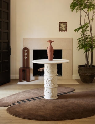 Eevi indoor/outdoor bistro table and Yoyo hand-loomed rug